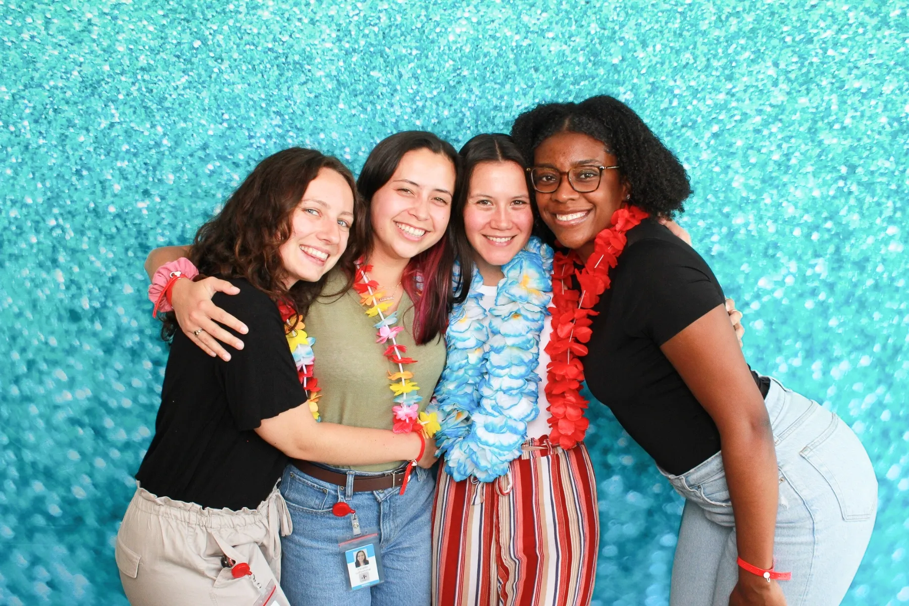 Photo booth with teal sparkle backdrop
