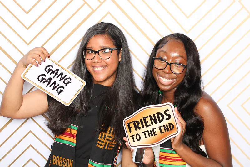 Wedding guests smiling at photo booth