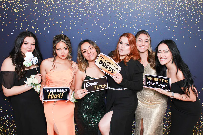 Photo booth guests posing together at event