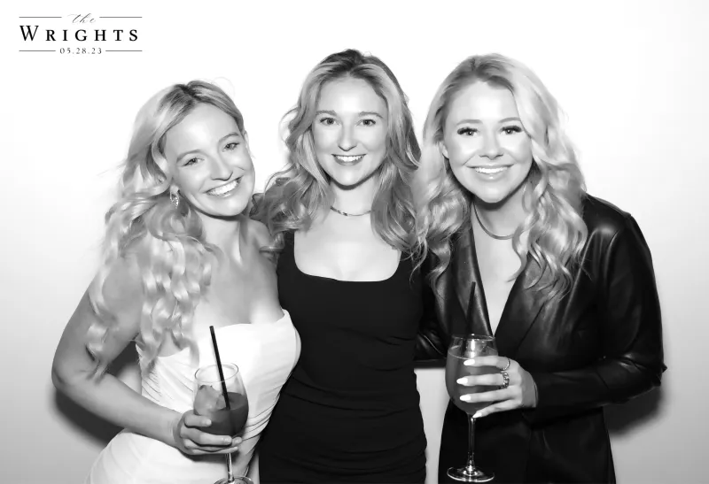 Three women at luxurious wedding with GLAM photo booth