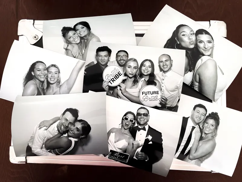 GLAM filtered printed photos displayed as wedding table decoration