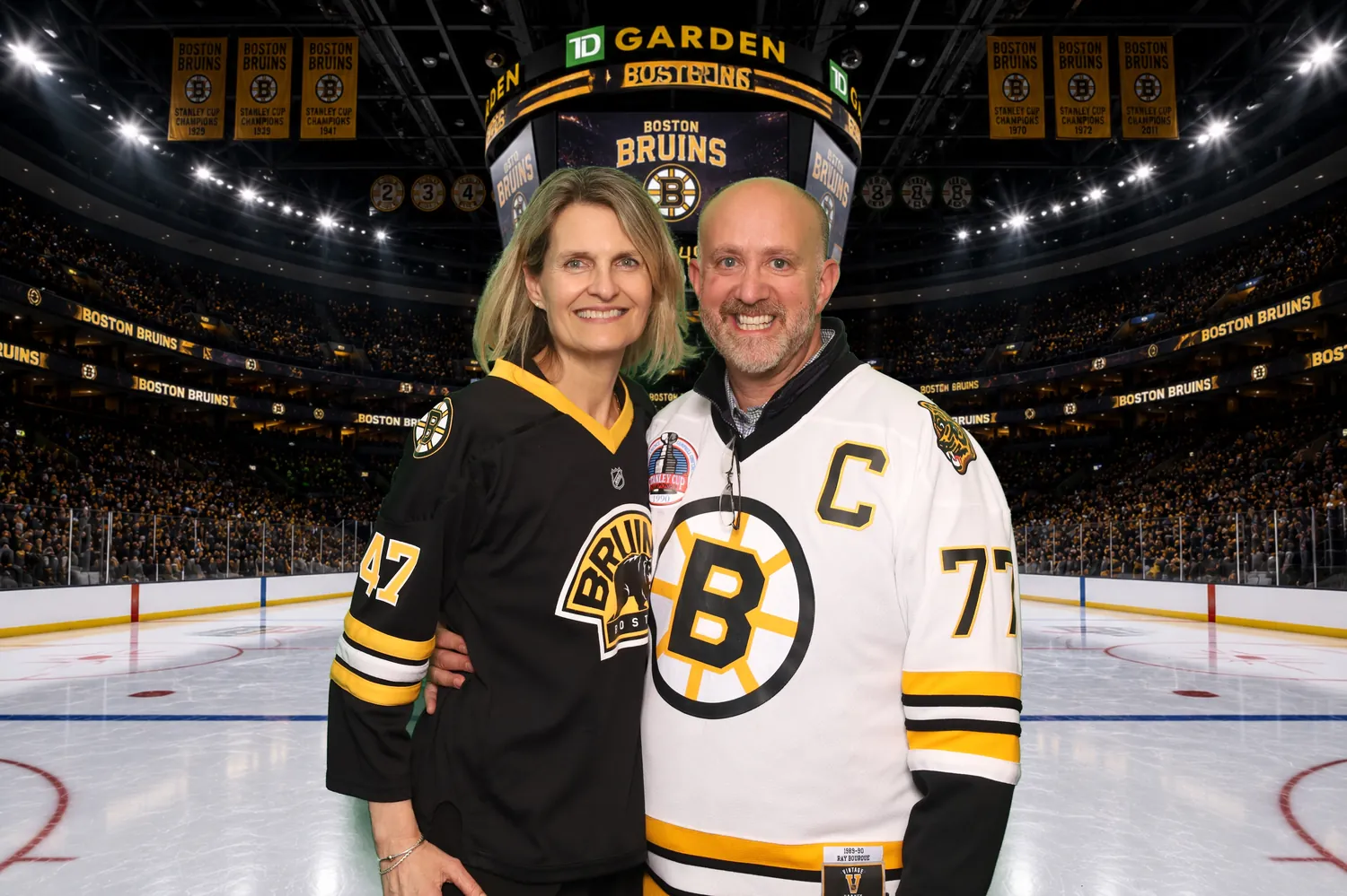 Couple in Boston Bruins jerseys composited onto the TD Garden ice with a green screen photo booth