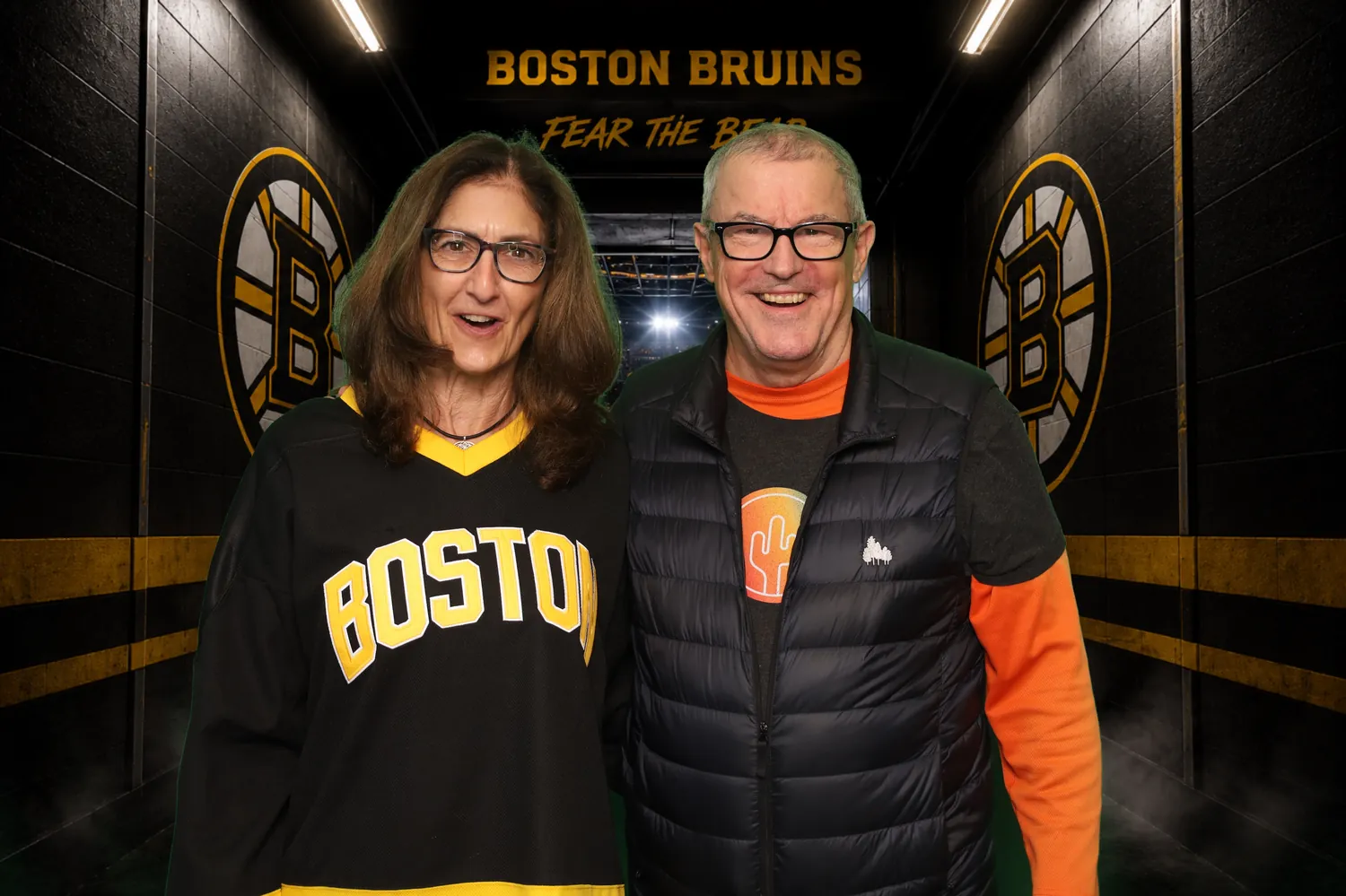 Couple in the Boston Bruins locker room green screen background