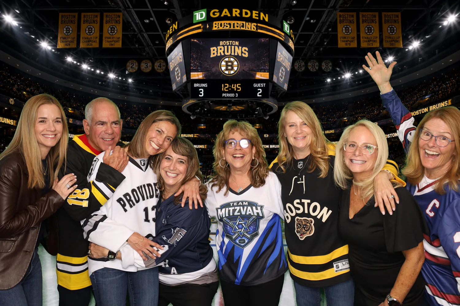 Family group celebrating on the TD Garden ice green screen background