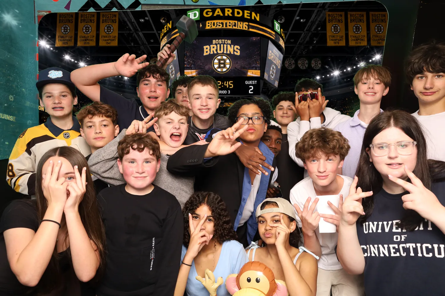 Large teen group celebrating on the TD Garden ice green screen background