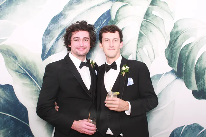 Cheek kisses for the birthday girl in the photo booth