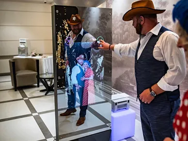 Mirror Booth photo strip printout with branded overlay from a party