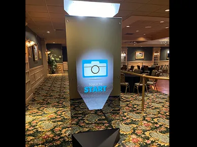 Mirror Booth full setup with red carpet and stanchions at a gala
