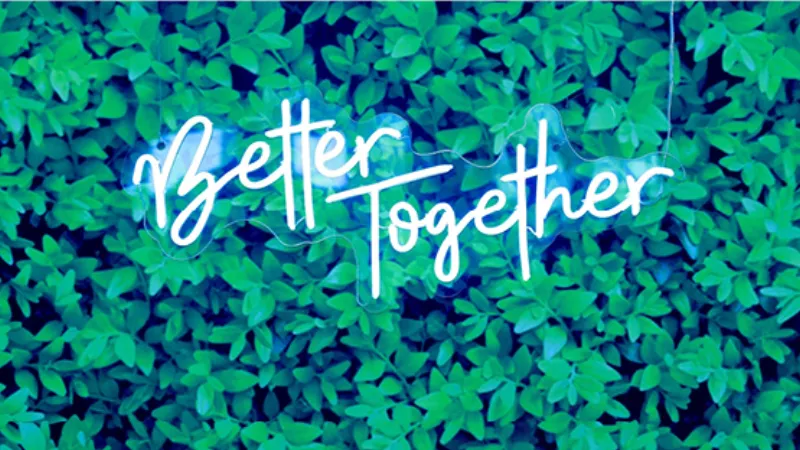 Custom neon sign hung on photo booth tension fabric backdrop