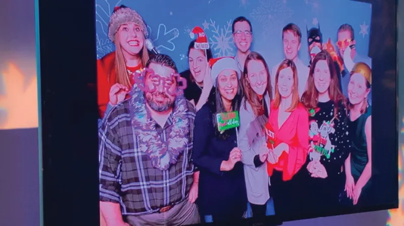 Live onsite TV slideshow displaying photo booth media at an event