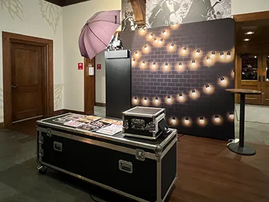 Open Air Photo Tower setup with custom backdrop at a party