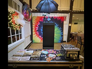 Wedding guests posing with props at the Open Air Photo Tower